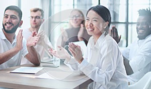 Diverse business team smiling to camera in office