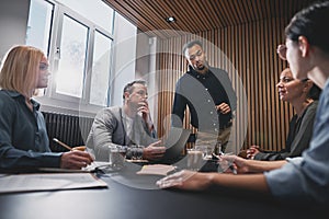 Diverse businesspeople discussing work during a boardroom meetin