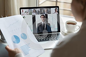 Diverse businesspeople have webcam conference on laptop together