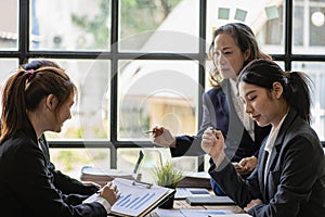 Diverse businesswoman leaders in office conference room Asian businesswoman