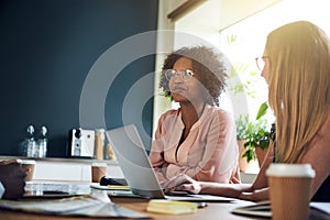 Diverse businesswomen having a meeting in an office boardroom