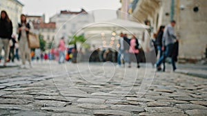 Diverse busy people walking in downtown pedestrians men and women tourists go on city street square walk on sidewalk