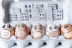 Diverse chicken eggs with doodle faces wearing medical masks with a city skyline on background