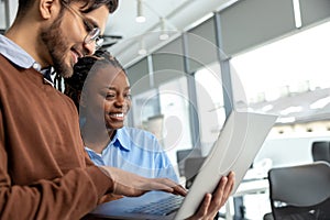 Diverse colleagues collaborating on project together