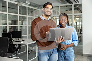 Diverse colleagues collaborating on project together