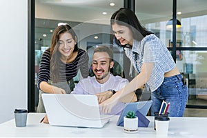 Diverse colleagues gather in brainstorm discuss statistics together.