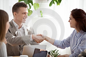 Diverse colleagues handshake getting acquainted at office meetin