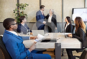 Diverse colleagues during meeting in boardroom