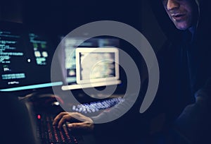 Diverse computer hacking shoot with computer