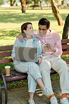 A diverse couple in vibrant attire