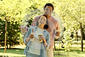 Diverse couple in vibrant attire enjoying