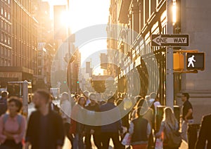 Diverse crowd of anonymous people walking down a busy street in New York City