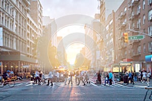 Diverse crowd of people walking across the busy street in Manhattan New York City photo