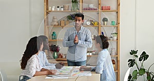 Diverse department staff professional architects listen to boss on meeting