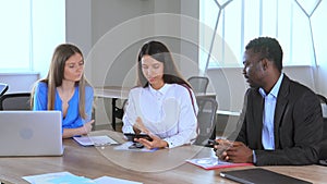 Diverse employees talking at the meeting