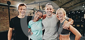 Diverse friends laughing after a workout at the gym