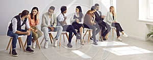 Diverse group of adult students having conversations at an English speaking club