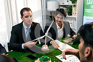 Diverse group of business people planning for alternative energy. Quaint