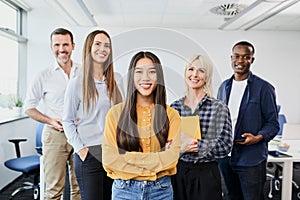 Diverse group of business people standing in office