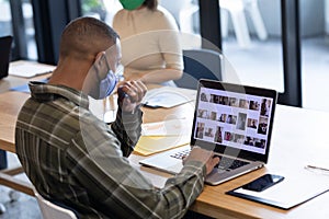 Diverse group of business people working in creative office