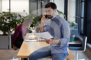 Diverse group of business people working in creative office