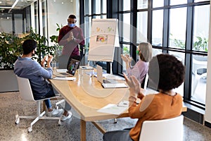 Diverse group of business people working in creative office