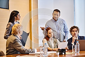 Diverse group of business professionals brainstorming