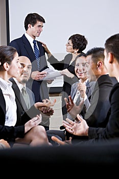 Diverse group of businesspeople conversing photo