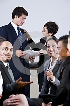 Diverse group of businesspeople conversing photo