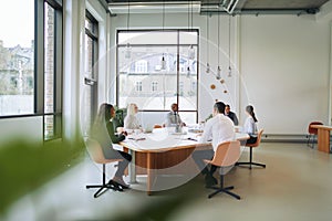 Diverse group of businesspeople having a boardroom meeting toget