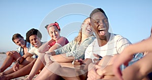 Diverse group of friends enjoy a beach day together