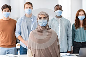 Diverse group of international people wearing medical protective face masks