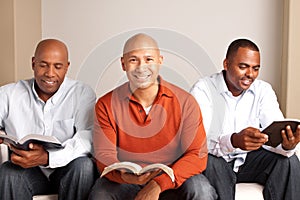 Diverse group of men studying together.