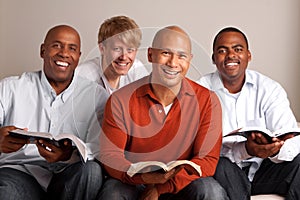 Diverse group of men studying together. photo
