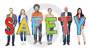 Diverse Group of People Holding Text Safety