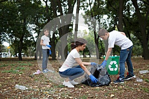 Diverse group of people team with recycle project, picking up trash in the park volunteer community service