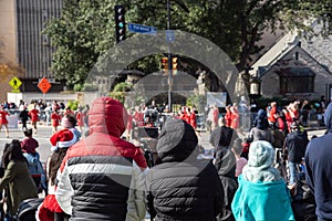 Diverse group of people in warm clothes jackets and live stream vlogger watching, broadcasting, streaming live street performance