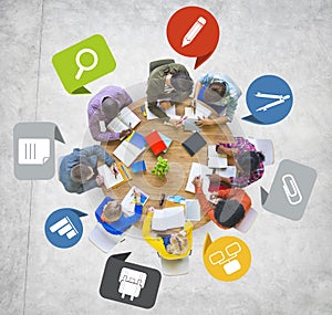 Diverse Group of People Working Around Table