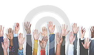 Diverse group of raised hands on white background