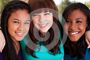 Diverse group of teens girls smiling.