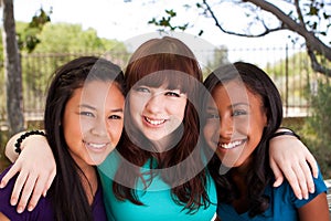 Diverse group of teens girls smiling.