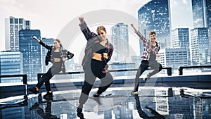 Diverse Group of Three Professional Dancers Performing a Hip Hop Dance Routine in Front of a Big D