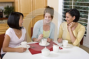 Diverse group of woman laughing and talking.