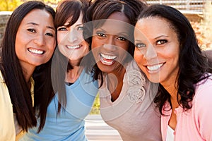 Diverse group of women talking and laughing.