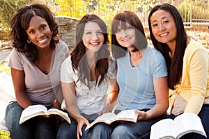 Diverse group of women talking and laughing.