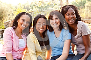 Diverse group of women talking and laughing.
