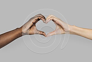 Diverse hands gestured in heart-shape photo