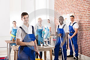 Diverse Janitors Cleaning The Office