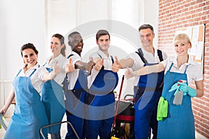 Diverse Janitors Showing Thumb Up Sign