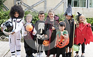 Diverse kids in Halloween costumes photo